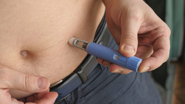 Person using GLP-1 medication which can be replicated through moderate intensity exercise at FitMe Wellness