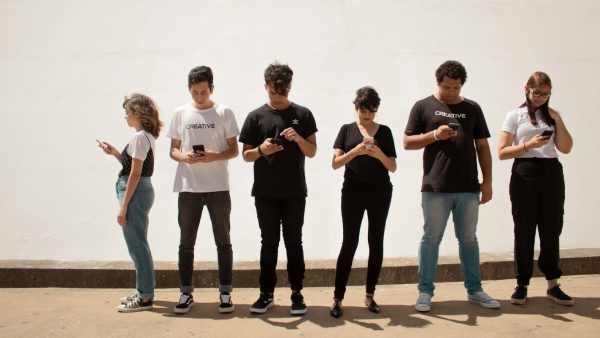 teenagers ignoring each other on their phones at fitme wellness